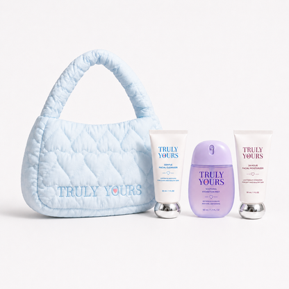 Little Care Set kids skincare gift set with mini cleanser, moisturizer, hydration mist, and Truly Yours handbag in blue, pink, and yellow