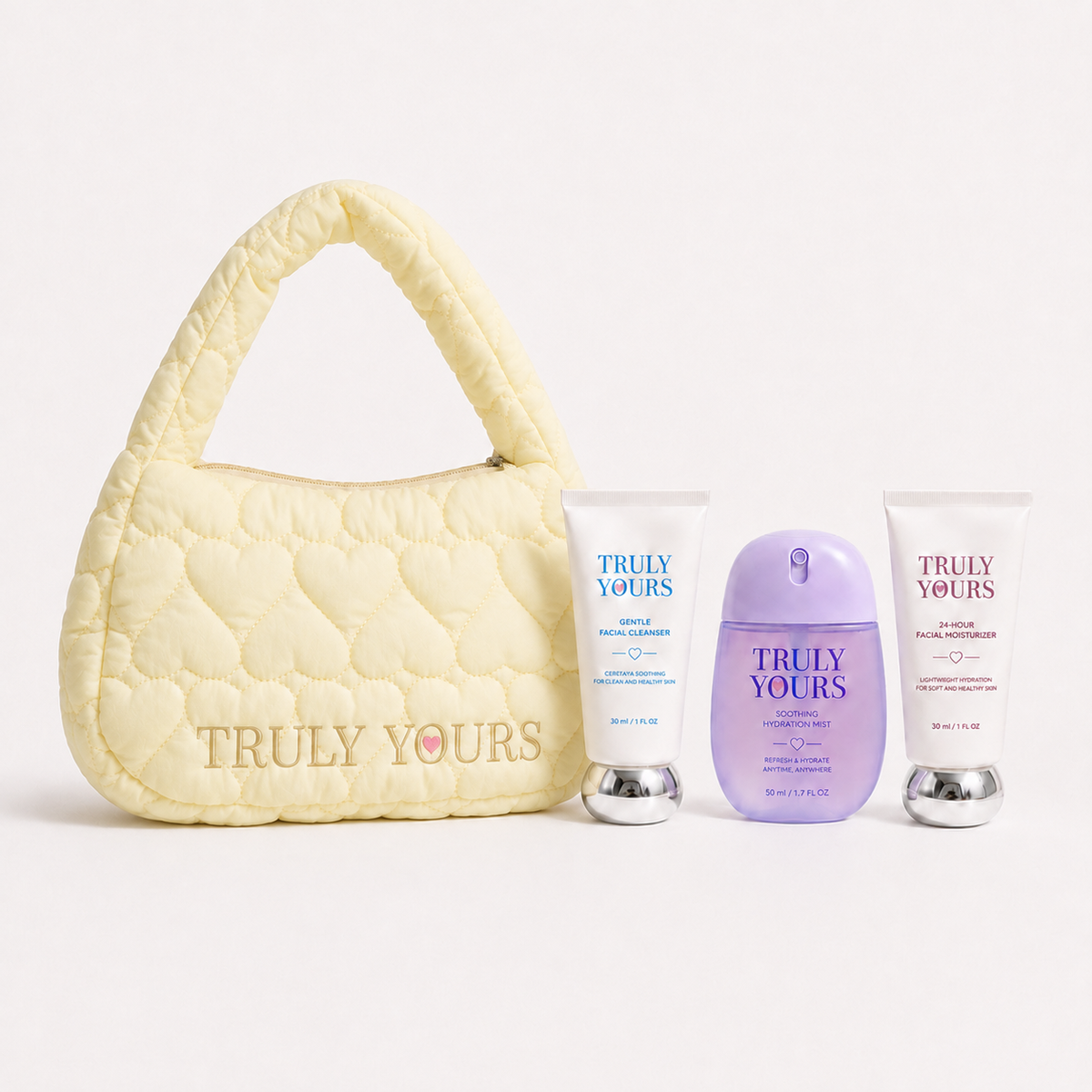 Little Care Set kids skincare gift set with mini cleanser, moisturizer, hydration mist, and Truly Yours handbag in blue, pink, and yellow